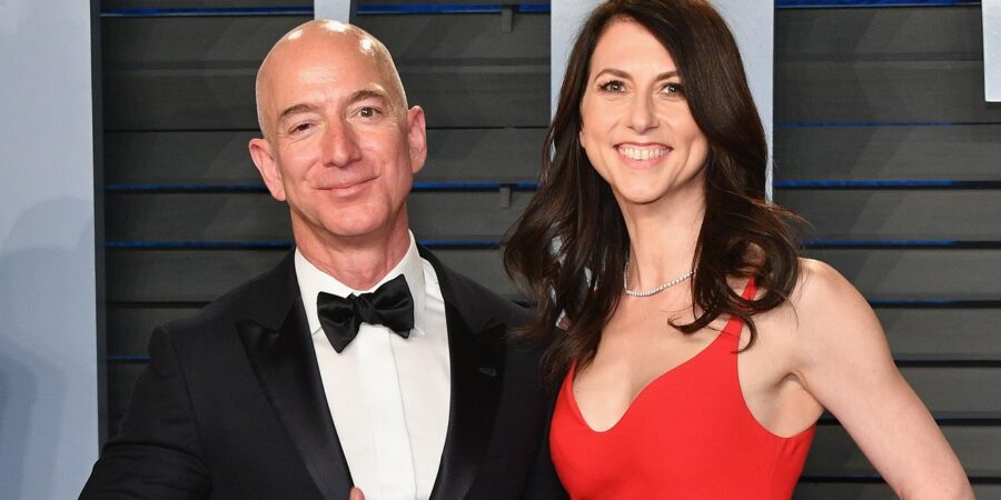 Bezos in a tux and his Wife in a red dress.