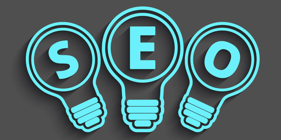 Image of Blue Lightbulbs And Text That Reads "SEO"